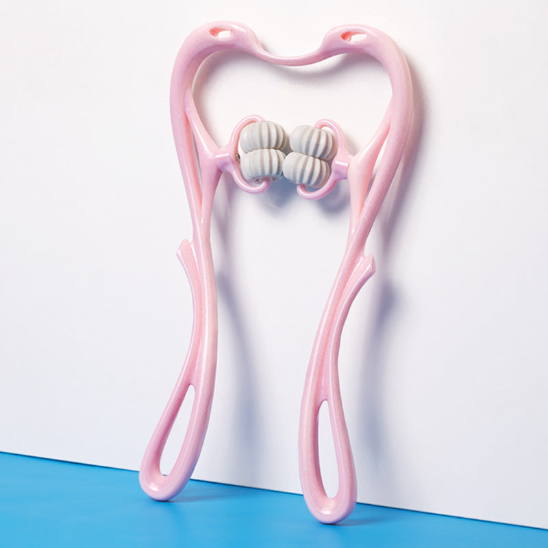 Pink facial roller with white beads on a white background