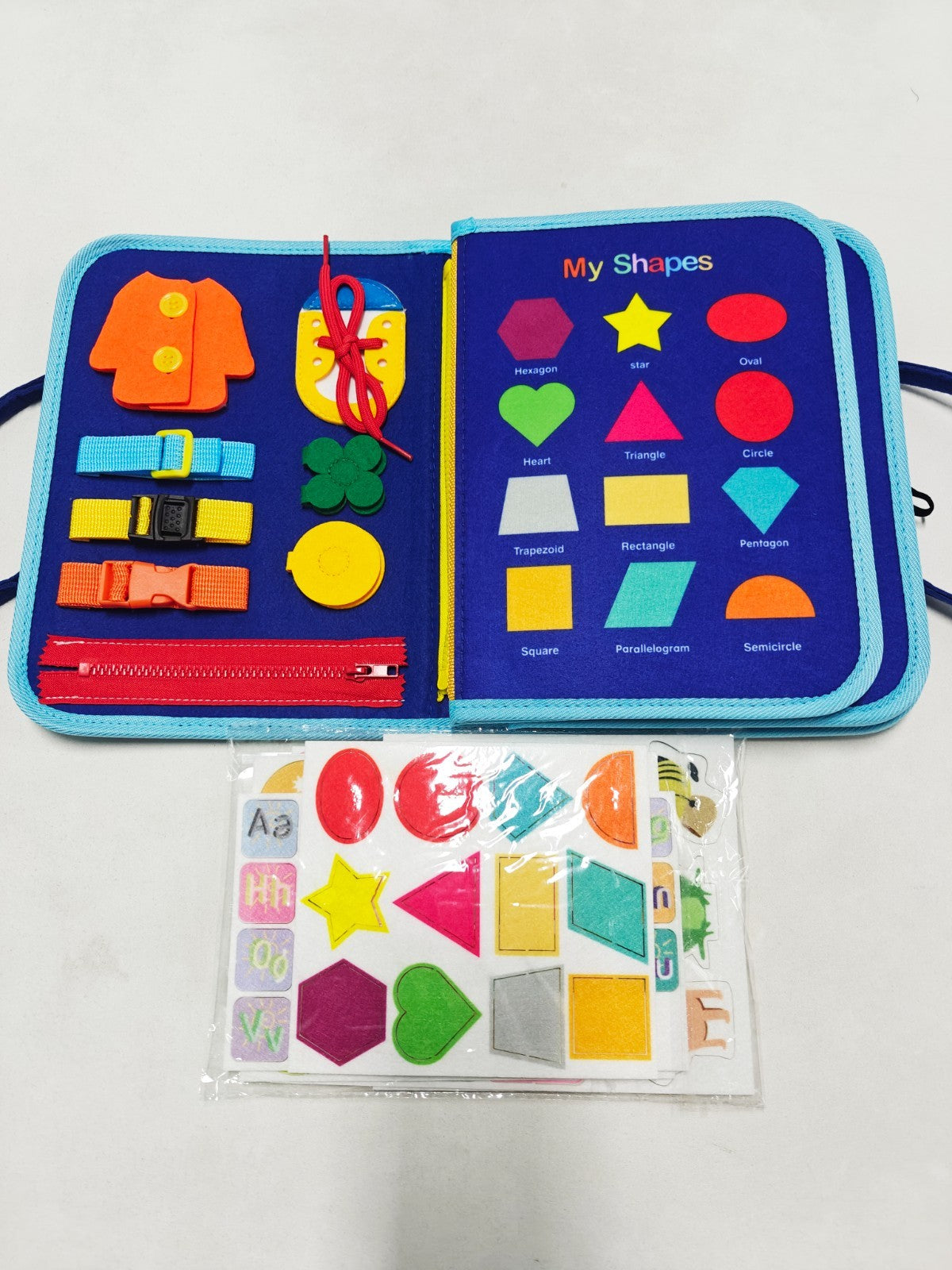 Children's educational book with colorful shapes and letters on a white background