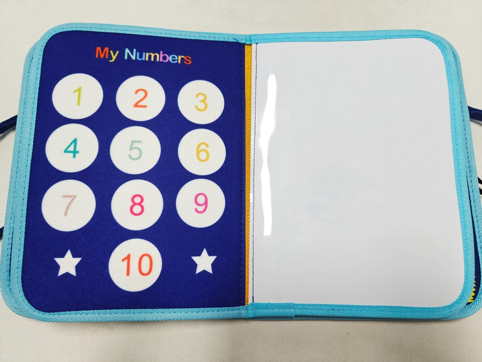Children's educational book with number buttons on a blue cover
