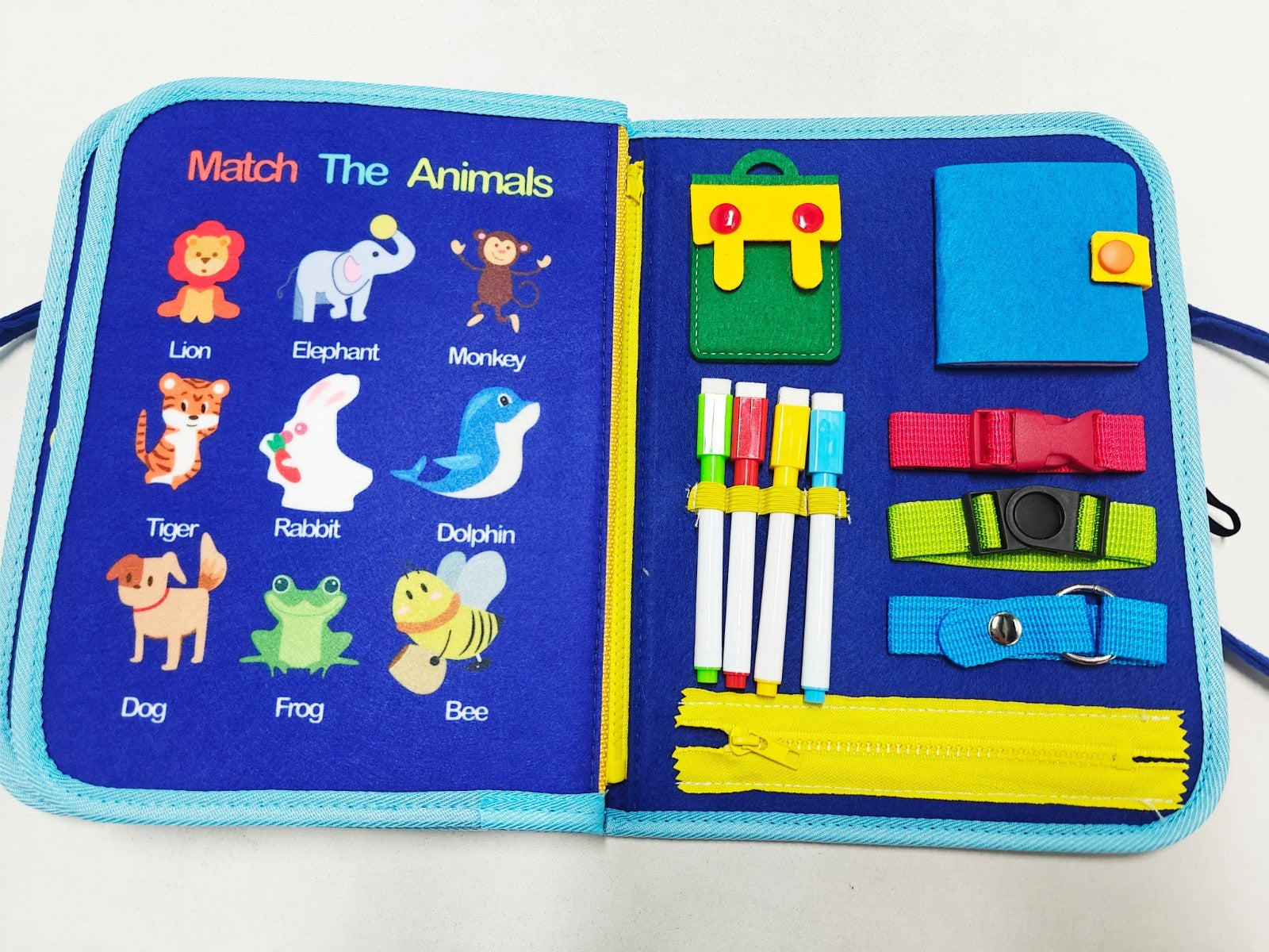 Educational toy with animal illustrations and colorful items on a blue background