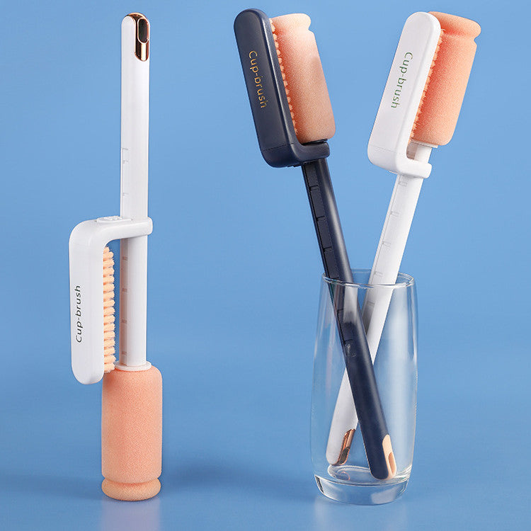 Set of cup brushes with different designs in a glass against a blue background
