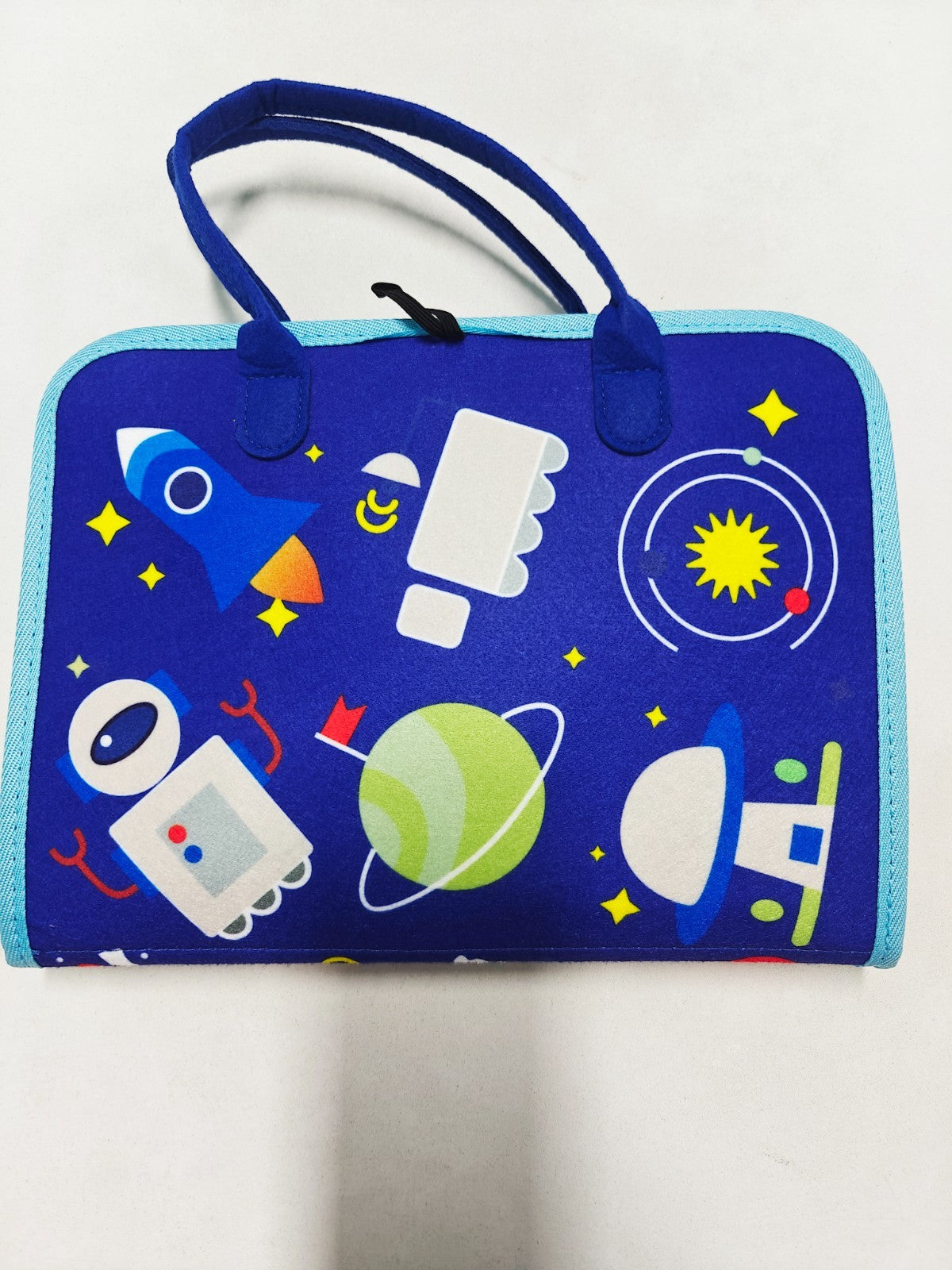 Blue bag with space-themed design on a white background